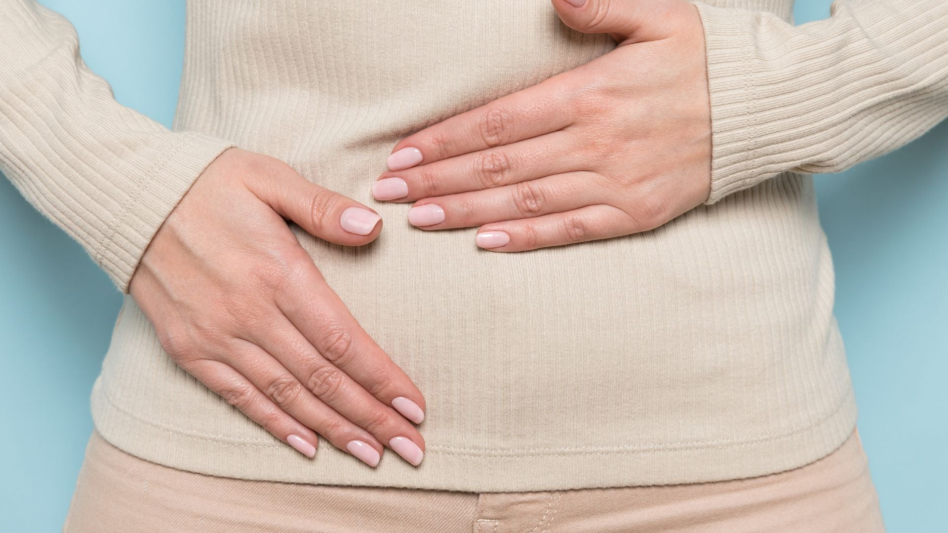 person touching their stomach
